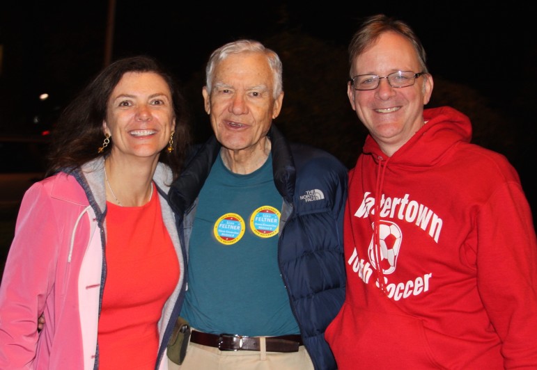 Lisa Feltner was all smiles after winning the District B Council seat. She posed with her father and husband outside Town Hall Tuesday night.