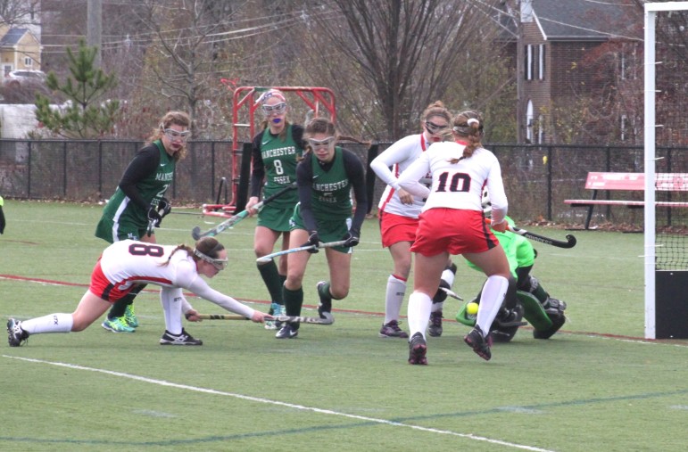 Watertown senior Christa Knell fires a ball into the Manchester-Essex goal for a first half goal.