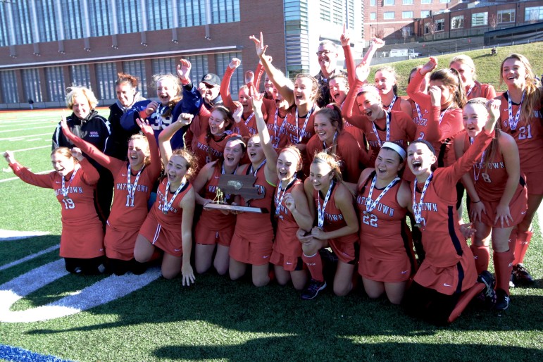 The 2015 Watertown High School field hockey team celebrates winning the state championship - the team's seventh straight.