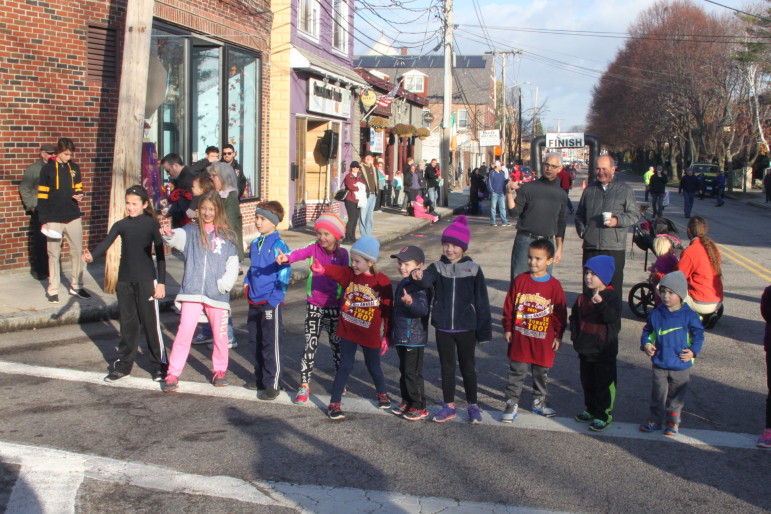 Youngsters line up for the kids' Turkey Trot, which goes around the block near Donohue's Bar & Grill.