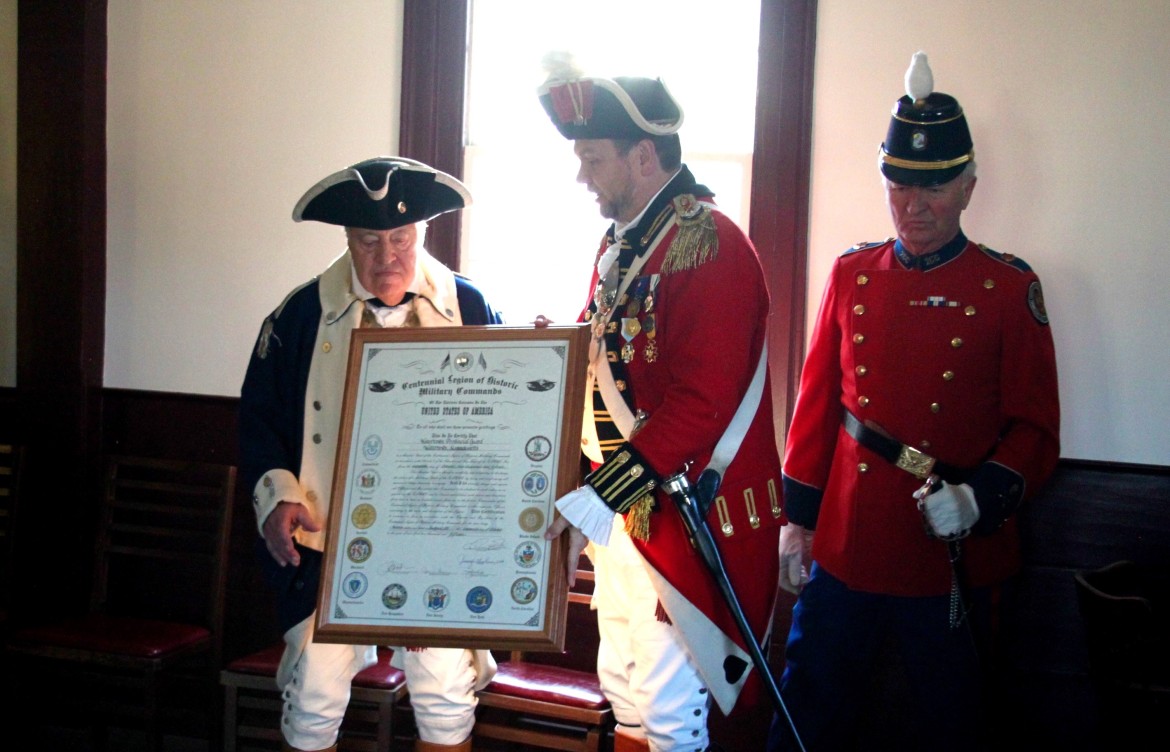 Commander of the Watertown Provincial Guard Jack Piantedosi accepts the certificate recognizing acceptance into the Centennial Legion of Historical Military Commands from Ron Barnes, commanding officer of the Legion.