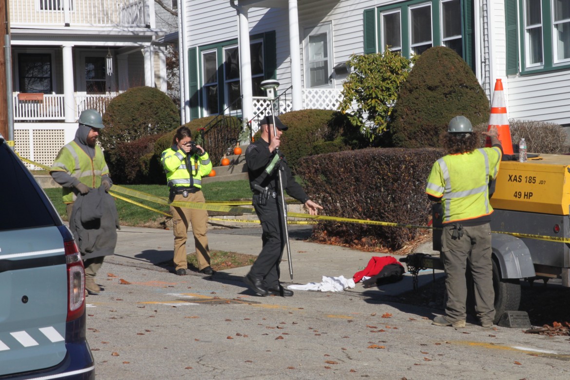 State Police accident scene investigators examine the driveway on Adams Avenue where a pedestrian was struck.