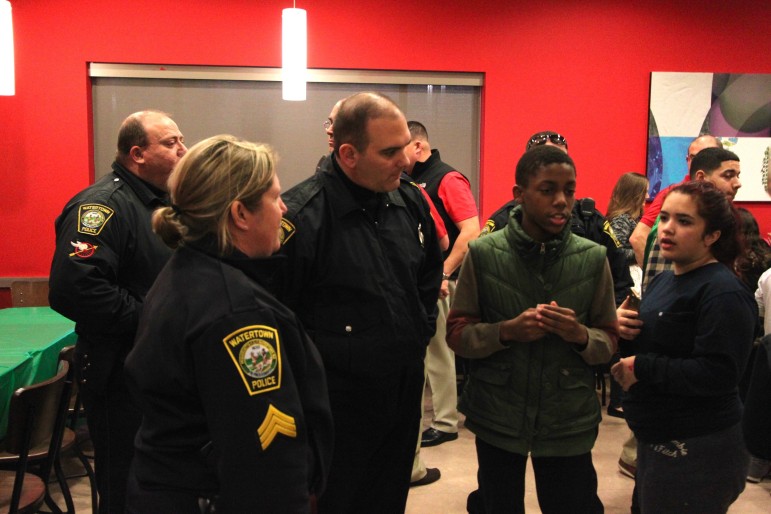 Watertown Sgt. Sheila Grady and Officer Ken Swift talk with some of the kids before they go shopping for gifts at Target.