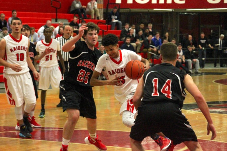 Watertown Freshman Yoseph Hamad drives to the basket against Winchester Friday night.