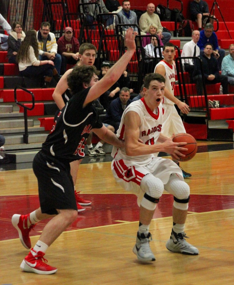 Watertown sophomore John Korte posts up against Winchester.