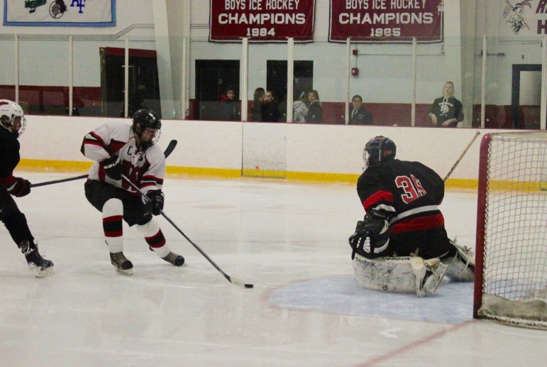 A Raiders forward skates in on the Winchester goal in the 4-2 loss Saturday.