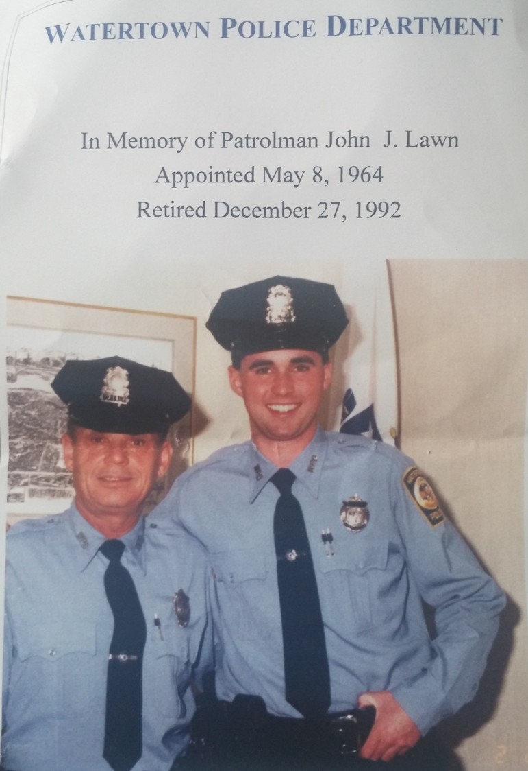 The back of the program for the swearing in ceremony included a photo of new Police Chief Michael Lawn as a young officer with his father John, who also served on the Watertown Police.