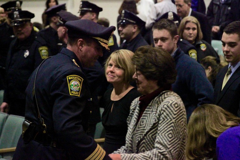 Watertown Police Chief Michael Lawn speaks with his wife, Karen, left, and mother, Mary, after being sworn in.