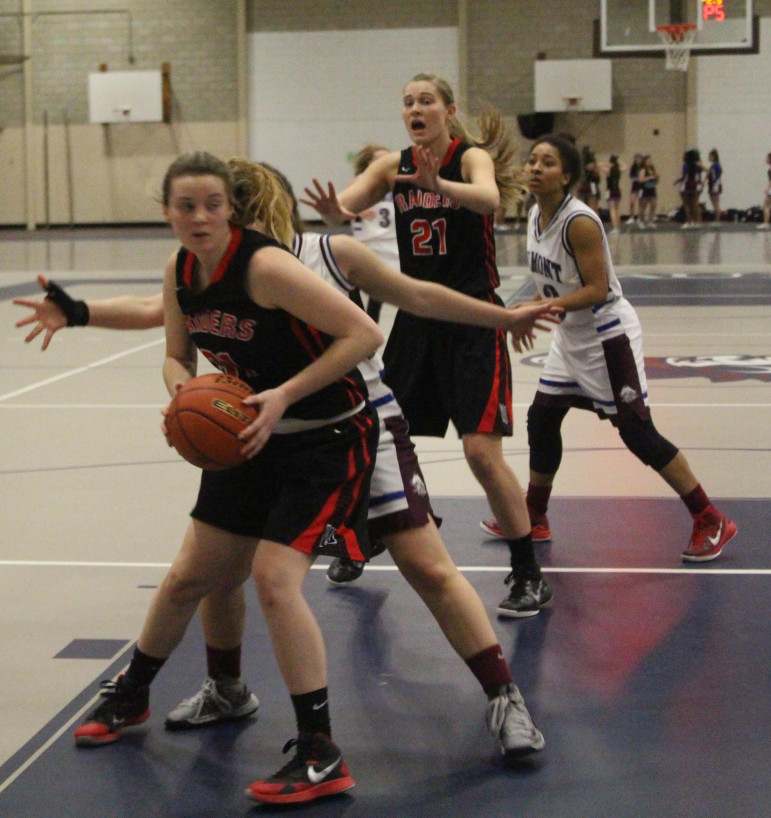 Watertown junior Shannon Murphy calls for the ball from senior Katelyn Rourke in the win over Belmont.