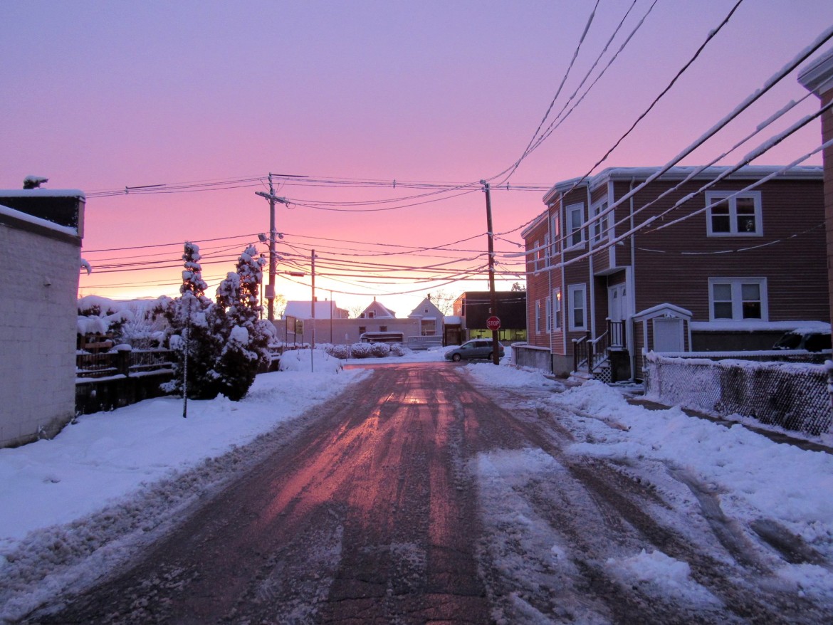 A winter sunset provides a pink and purple sky after Friday's snow storm.