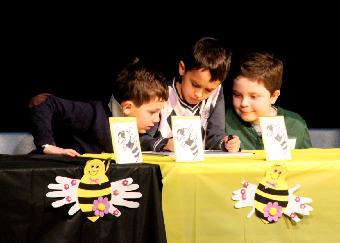 A team of second graders work on a word during the sixth annual Town-wide Spelling Bee.