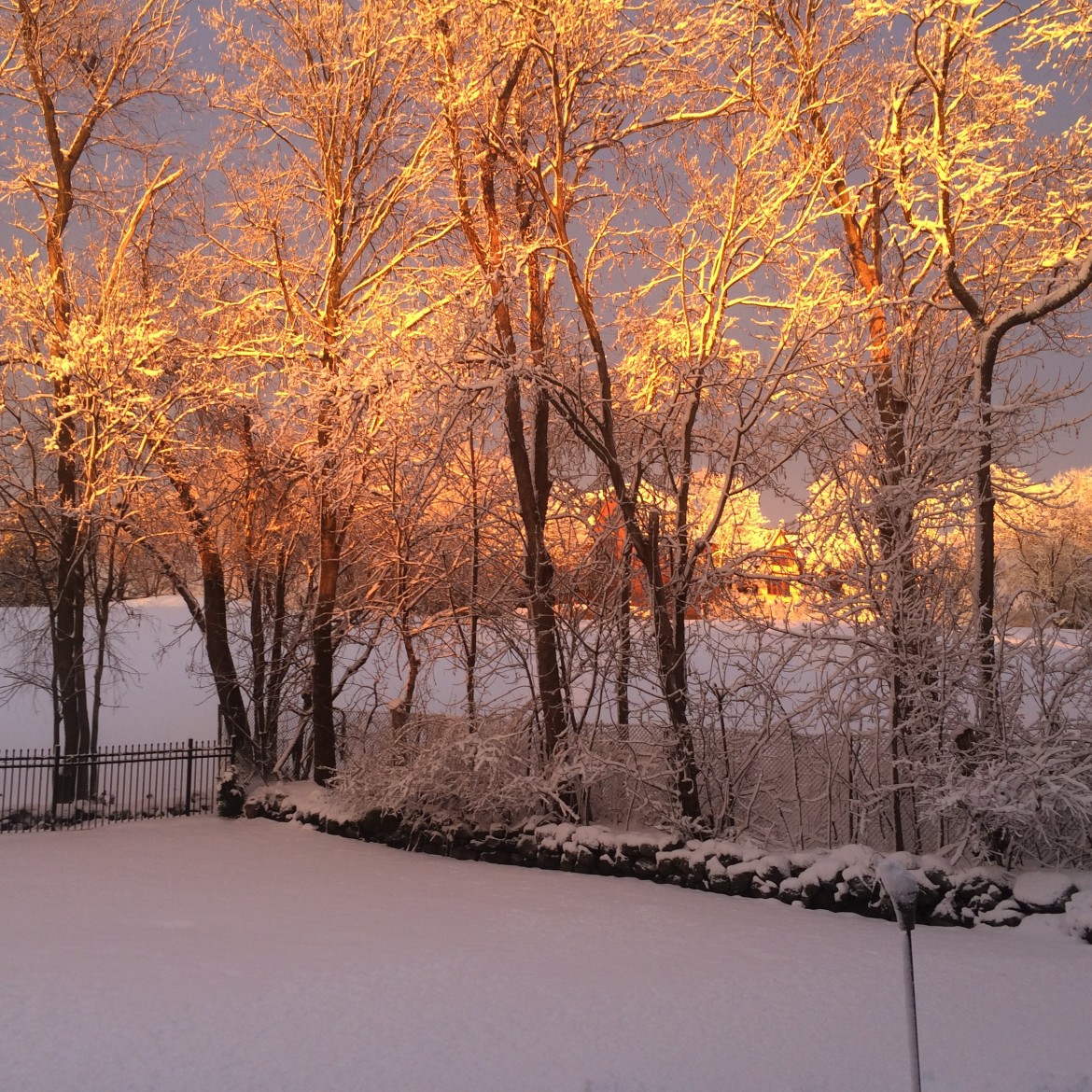 The sun sets after a snowy day in Watertown.