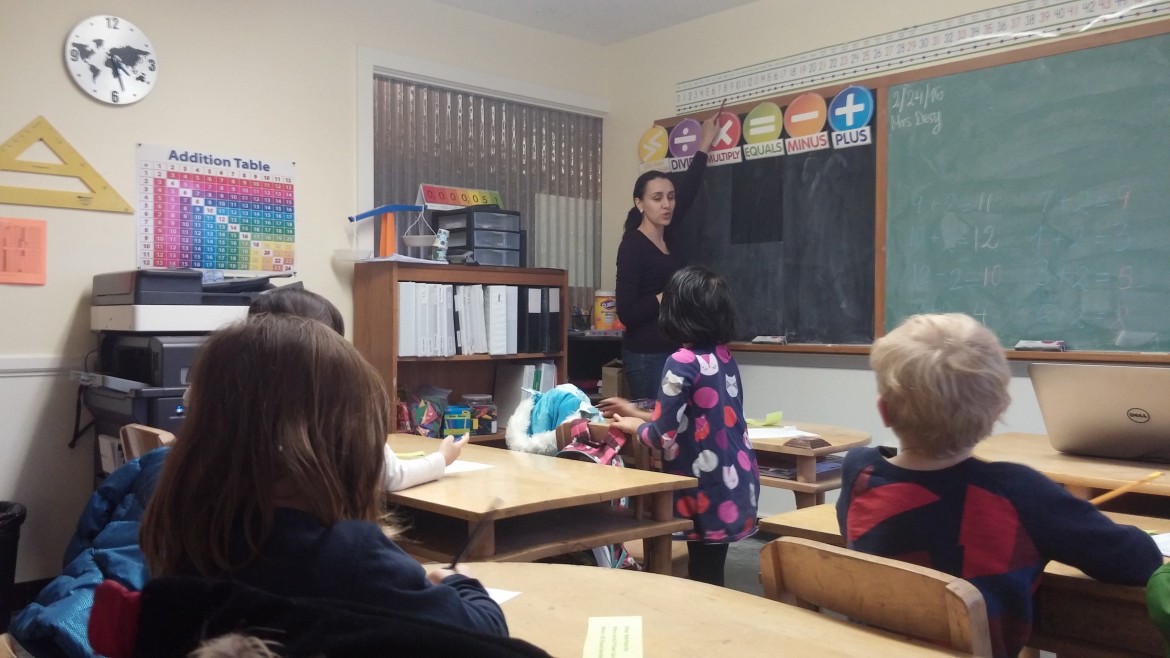 A teacher shows kindergartners strategies to learn math at the Russian School of Math in Belmont.