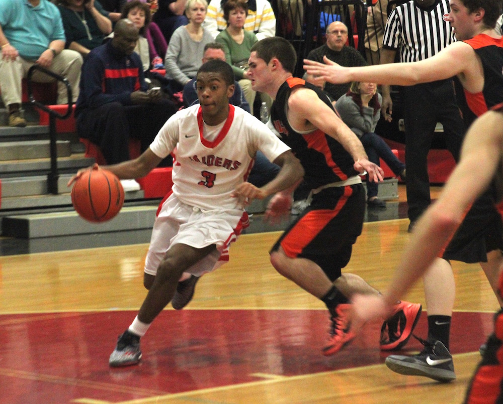 Watertown guard Julio Fulcar dribbles to the hoop against Ipswich in the state tournament game. He scored 11 points. 