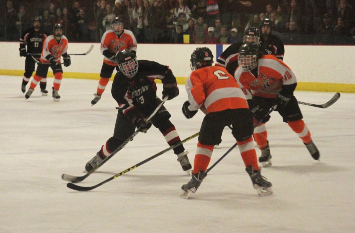 Watertown senior Tyler Poulin fires a slapshot against Wayland in the North Section final. 