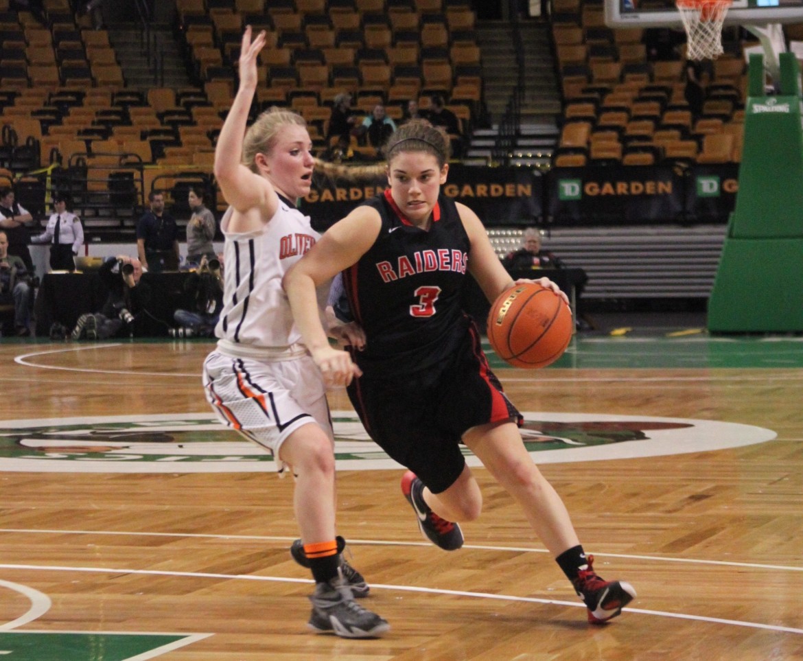 Watertown senior guard Michaela Antonellis dribbles around an Oliver Ames defender in the state semifinal victory.