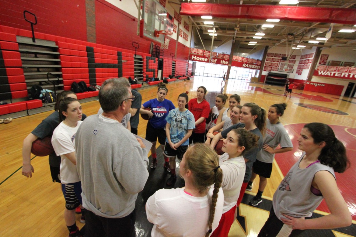 The Watertown girls basketball team gets a briefing about their trip to Springfield for the state final from Athletic Director Mike Lahiff.