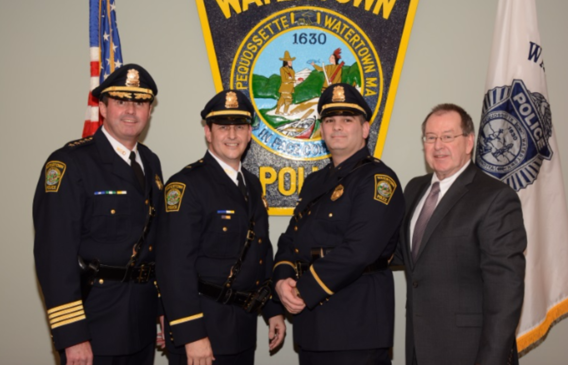 Newly promoted Lt. Kenneth Delaney (second from left) and Sgt. Kenneth Swift (second from right) stand with Police Chief Michael Lawn, left, and Town Manager Michael Driscoll. 