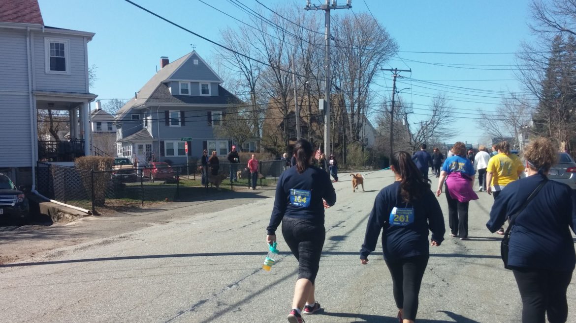 Walkers in the Watertown Strong 5K approach the intersection of Laurel Avenue and Dexter Street where police battled the Boston Marathon Bombers on April 19, 2013.