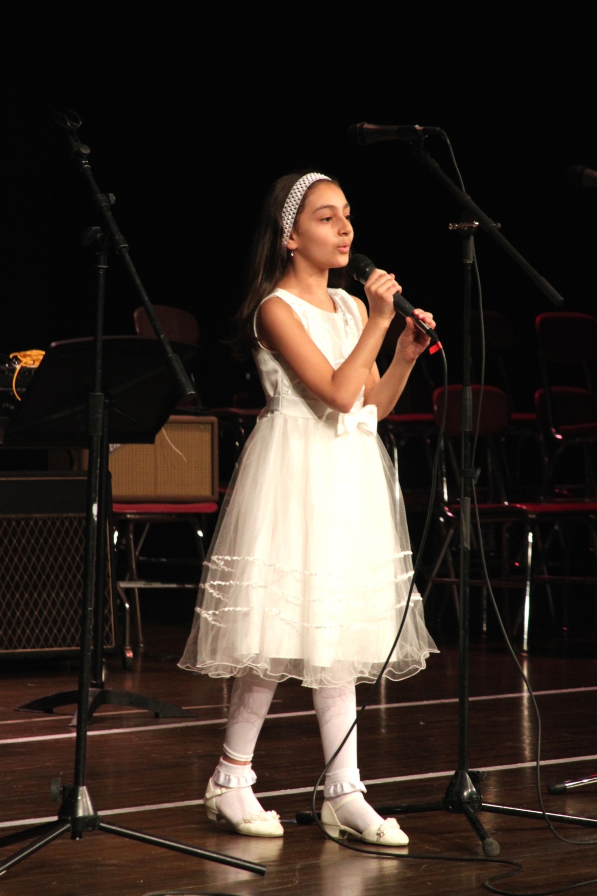 A young singer from the Zangakner Armenian Children's Chorus performs at MusicFest.