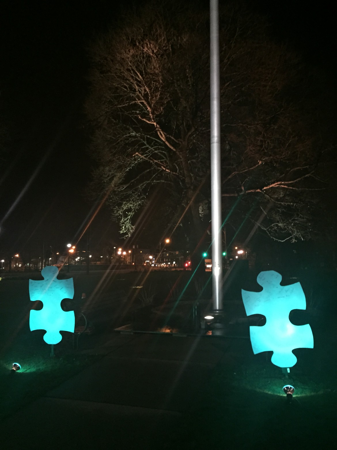 These blue puzzle pieces in Watertown Square are part of Light It Up Blue, to mark Autism Awareness Day. 