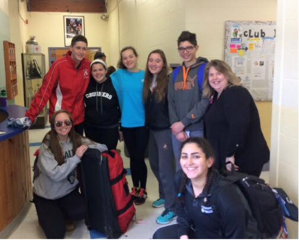 Members of the Wavemakers, the Watertown Boys & Girls Club swim, get ready to head to the airport to flying to Florida for Nationals!