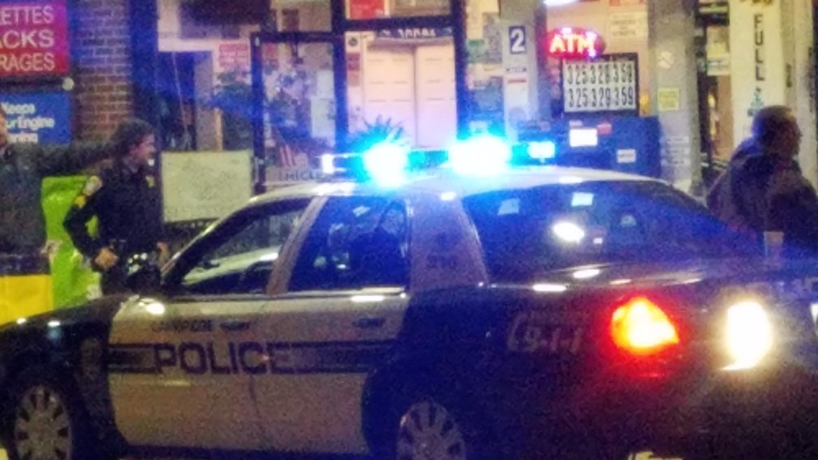 Mark Wahlberg, left of the car, shoots a scene from "Patriots Day" at a gas station on Main Street in Watertown.