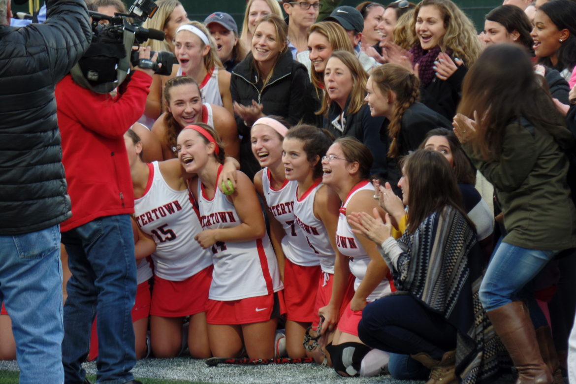 WHS student Erika Libertini's "Team celebrates record-setting win" was an honorable mention in the Watertown Savings Bank High School Photo Contest.