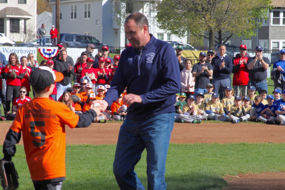 Watertown Police Chief Michael Lawn threw out the first pitch at the Watertown Youth Baseball and Softball celebration. He thanked the Watertown Little League player who caught the ball.