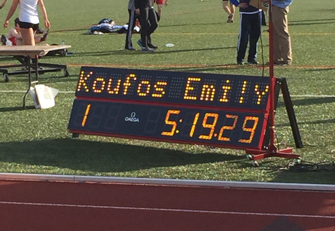 The sign shows the new Watertown High School record in the girls mile set by sophomore Emily Koufos.