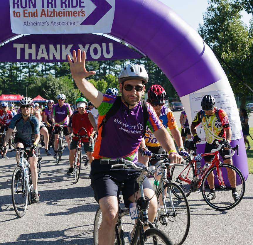 Doug Orifice waves at the Ride to End Alzheimer's. The Watertown resident will ride the 62 miles again this year.