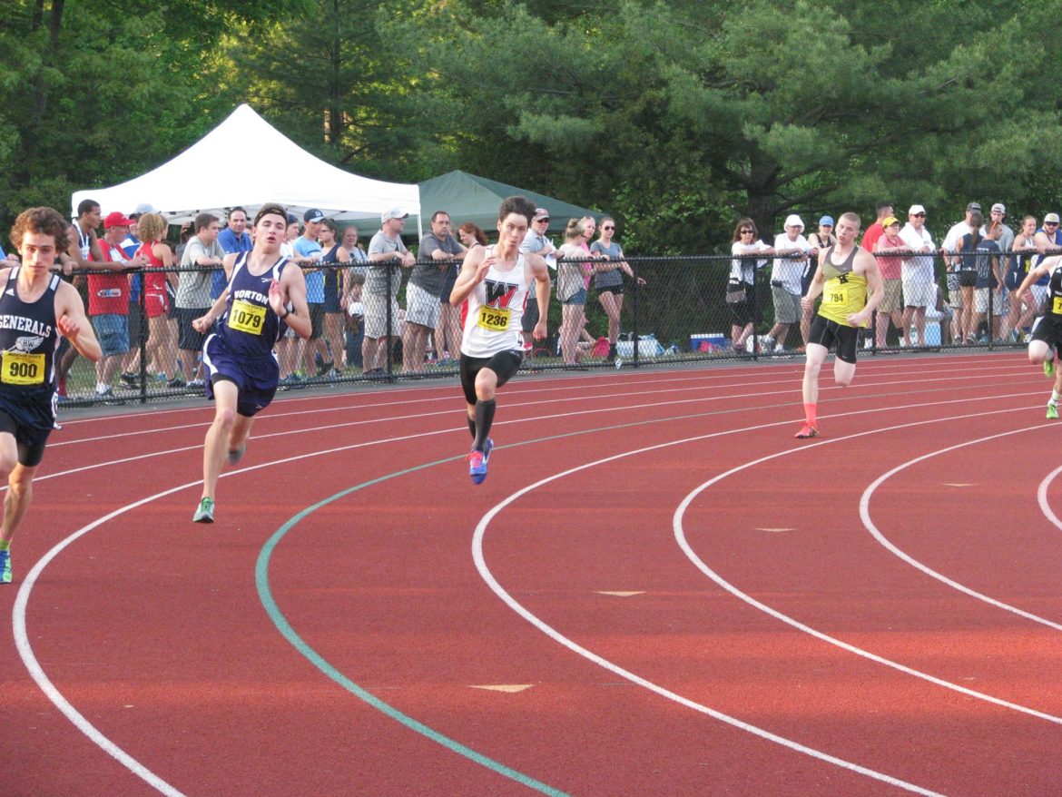 Watertown senior Austin Lin, in white, placed third at the All-State Meet. Here he runs in the Div. 4 Meet.