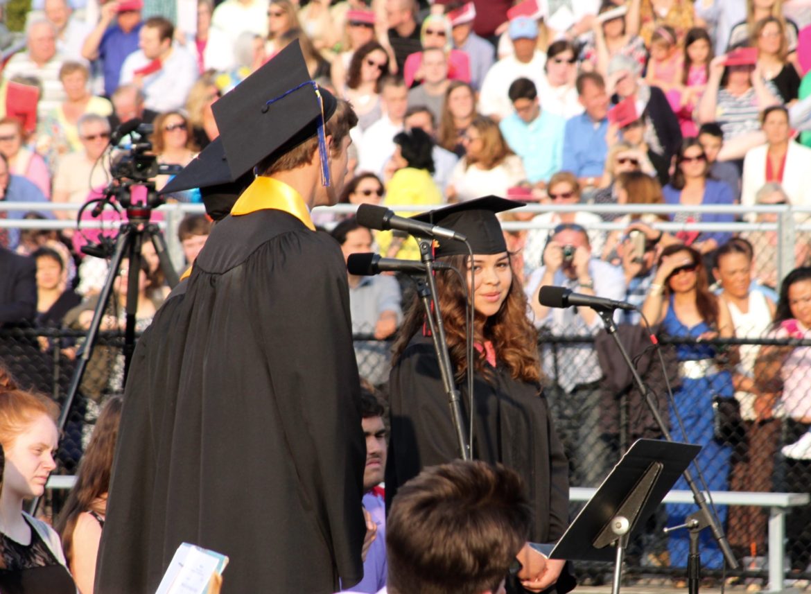 Seniors Jeremy Breen, Niko Carvajal and Ivana Mendez Juliao sing during the Class of 2016 graduation.