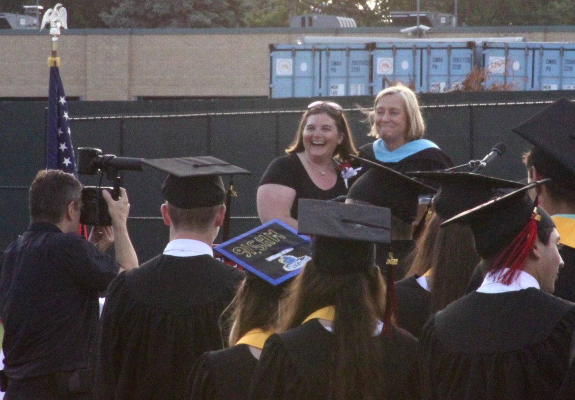 Lead Guidance Counselor Adrienne Eaton, left, received the Above and Beyond the Call of Duty award from Principal Shirley Lundberg at the Watertown High School graduation.