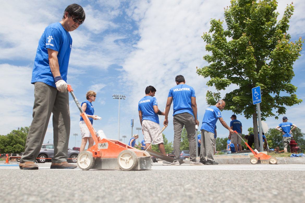 Another project during the Tufts Health Plan volunteer day was building ramps and and striping the lot at Community Rowing in Brighton.