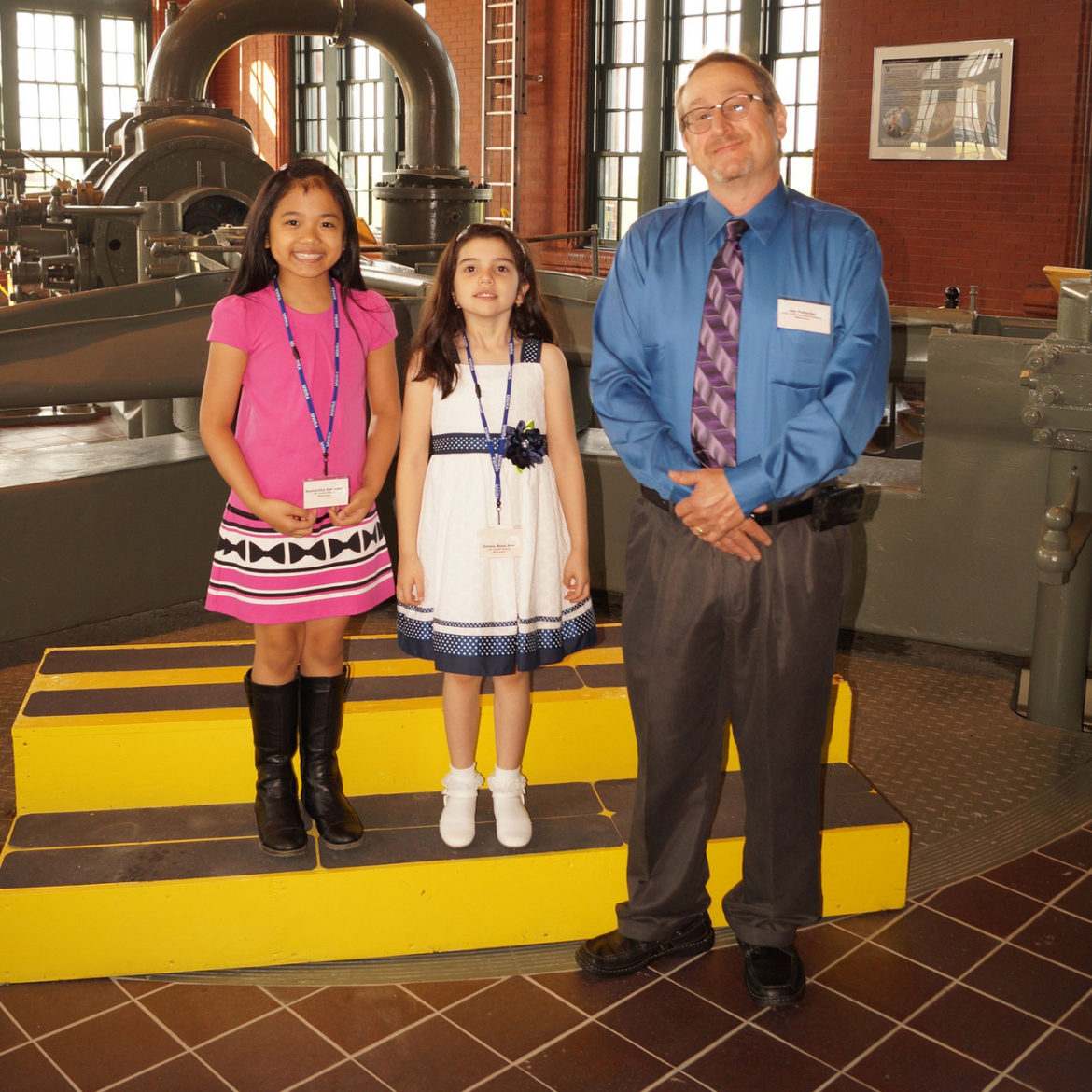 Poster contest winners Samantha Salvador and Emma Rose Noe, Town Water and Sewer Superintendent Jay Pelletier.