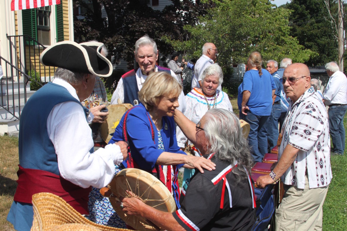 Governor's Councilor Marilyn Petitto Devaney, of Watertown, greets Ronald Jerome, Roland Jerome, chief of the United Native American Cultural Center in Devens, during the celebration of the signing of the Watertown Treaty – the first treaty signed by the U.S. and united the Americans with Indian tribes. 