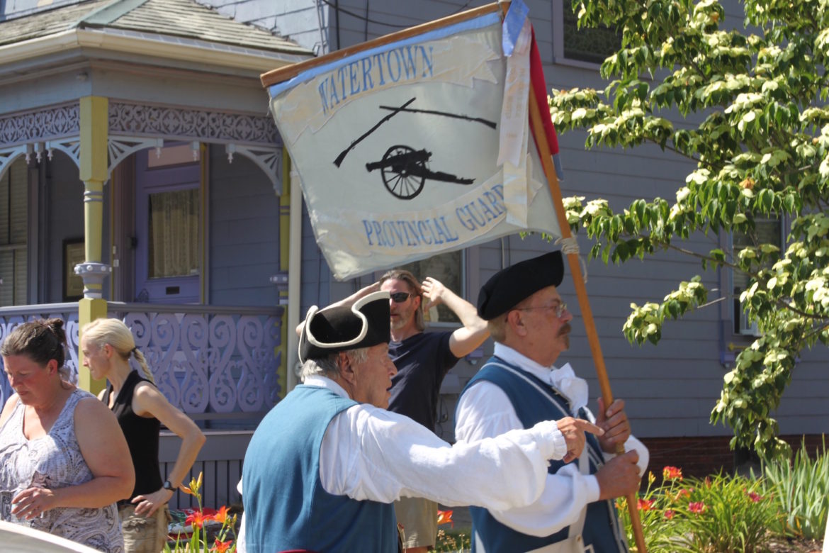 Members of the Watertown Provincial Guard, a historic reenactment group, stand guard outside the Edmund Fowle House during the celebration of the Treaty of Watertown and first reading in the state of the Declaration of Independence.
