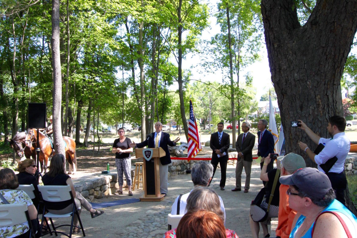 Leo Roy, commissioner of the Department of Conservation and Recreation, speaks at the ribbon cutting at the Watertown Riverfront Park and Braille Trail.