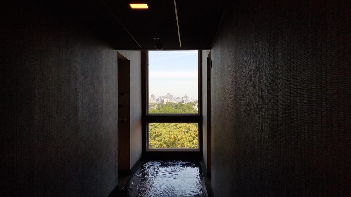 The Boston skyline can been seen from the window at the end of the hallway at the new Residence Inn by Marriott in Watertown.