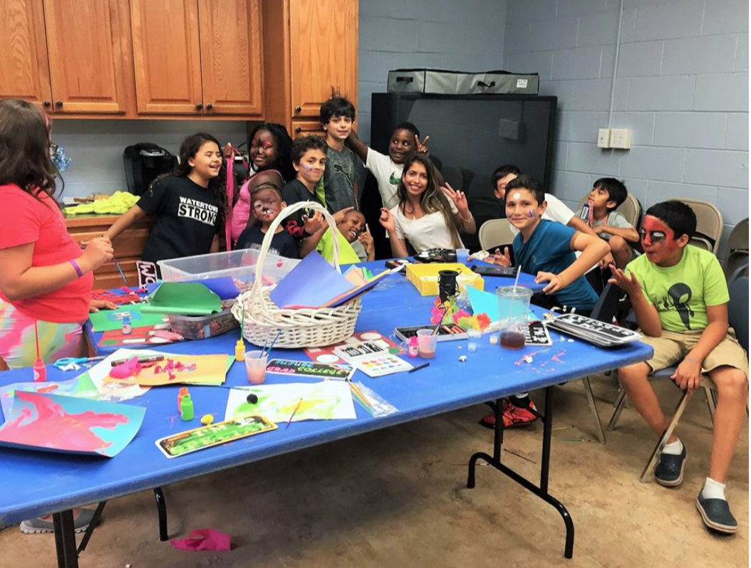 Watertown Boys and Girls Club members in the Multi-Purpose Room having fun with face painting and arts and craft projects.