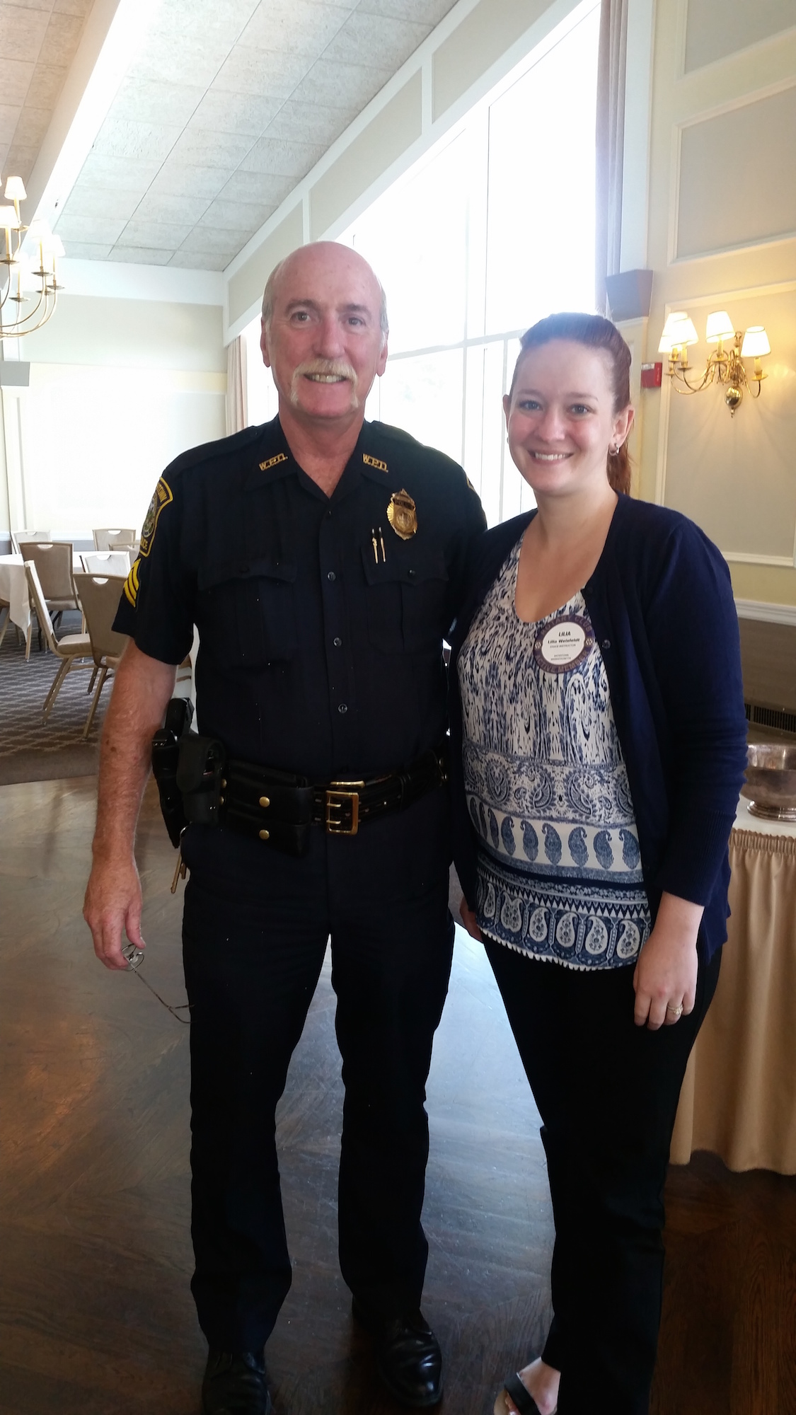 Watertown Police Sgt. Jeff Pugliese and Lilia Weisfeldt, President of the Rotary Club of Watertown during a recent Rotary Club meeting.
