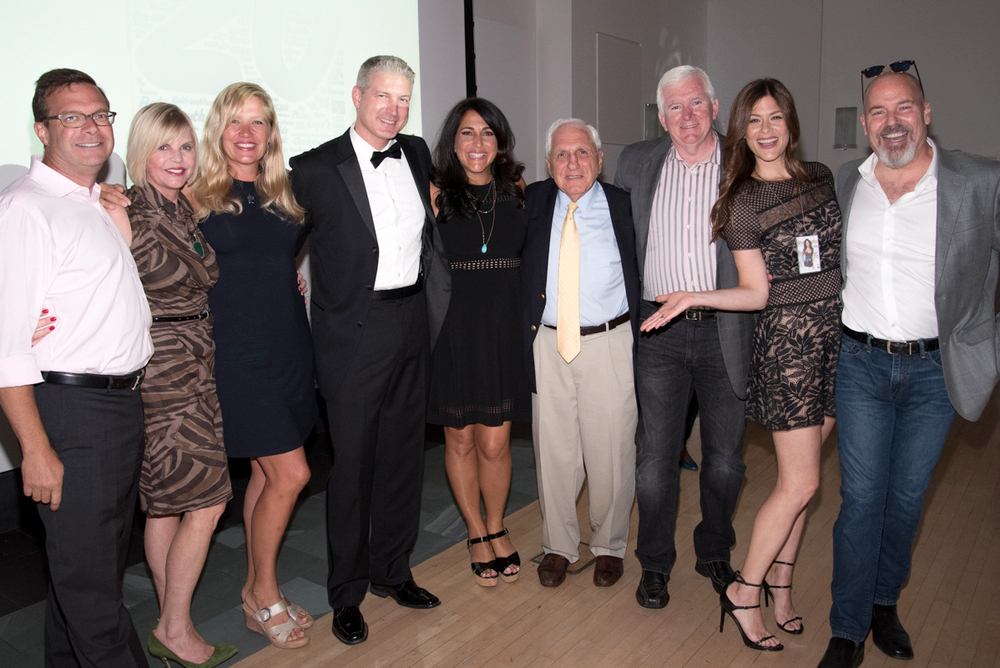 Among the 300 people celebrating Improper Bostonian's 25th anniversary were, left to right, Jack Klinck, Julie Kahn, Heather Walker, Bill Eppich, Wendy Semonian Eppich (publisher), Leon Semonian (Wendy's father), Paul Barclay, Lynn Hoffman and William Eveleth.