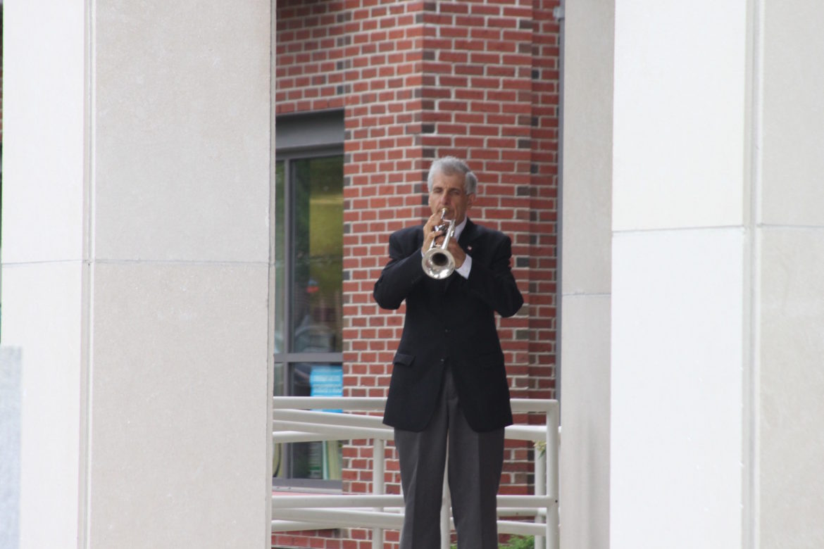 A trumpeter plays Taps as the flag was lowered to half staff during the 9-11 remembrance ceremony at the Watertown Fire Station.