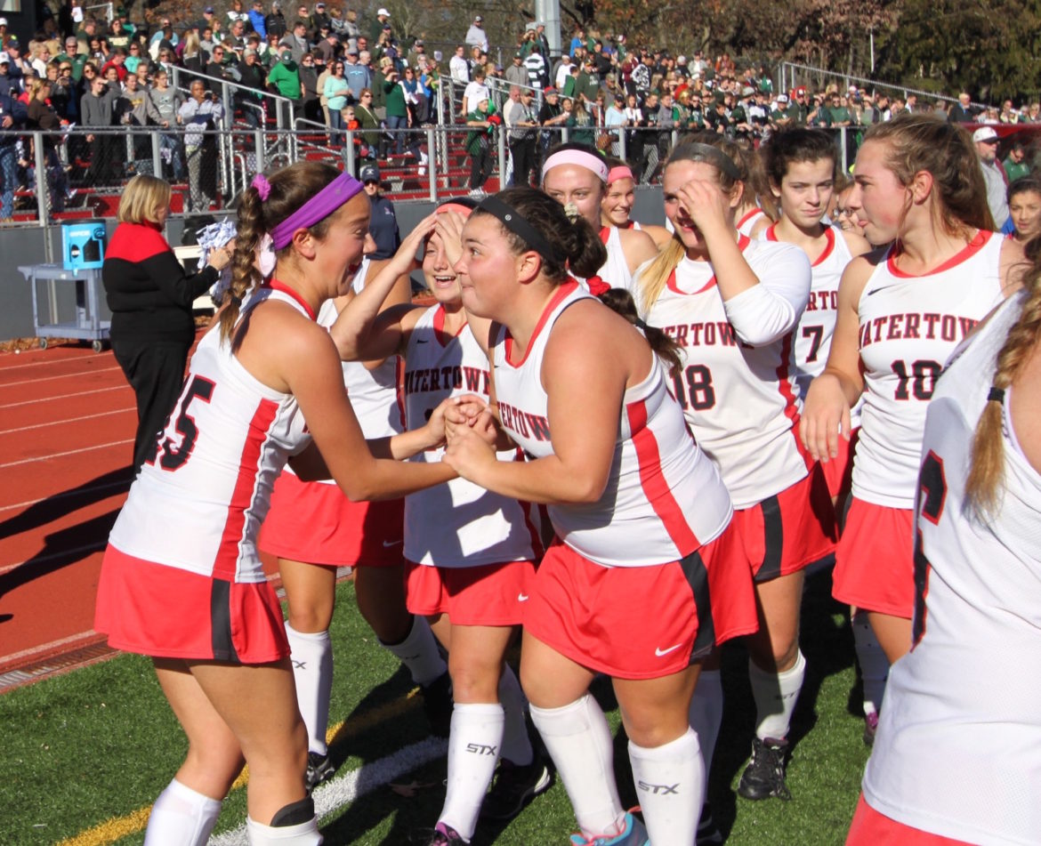 Watertown field hockey players Olivia Venezia, left, and Maddie Leitner celebrate after winning a thrilling State Final over Oakmont.