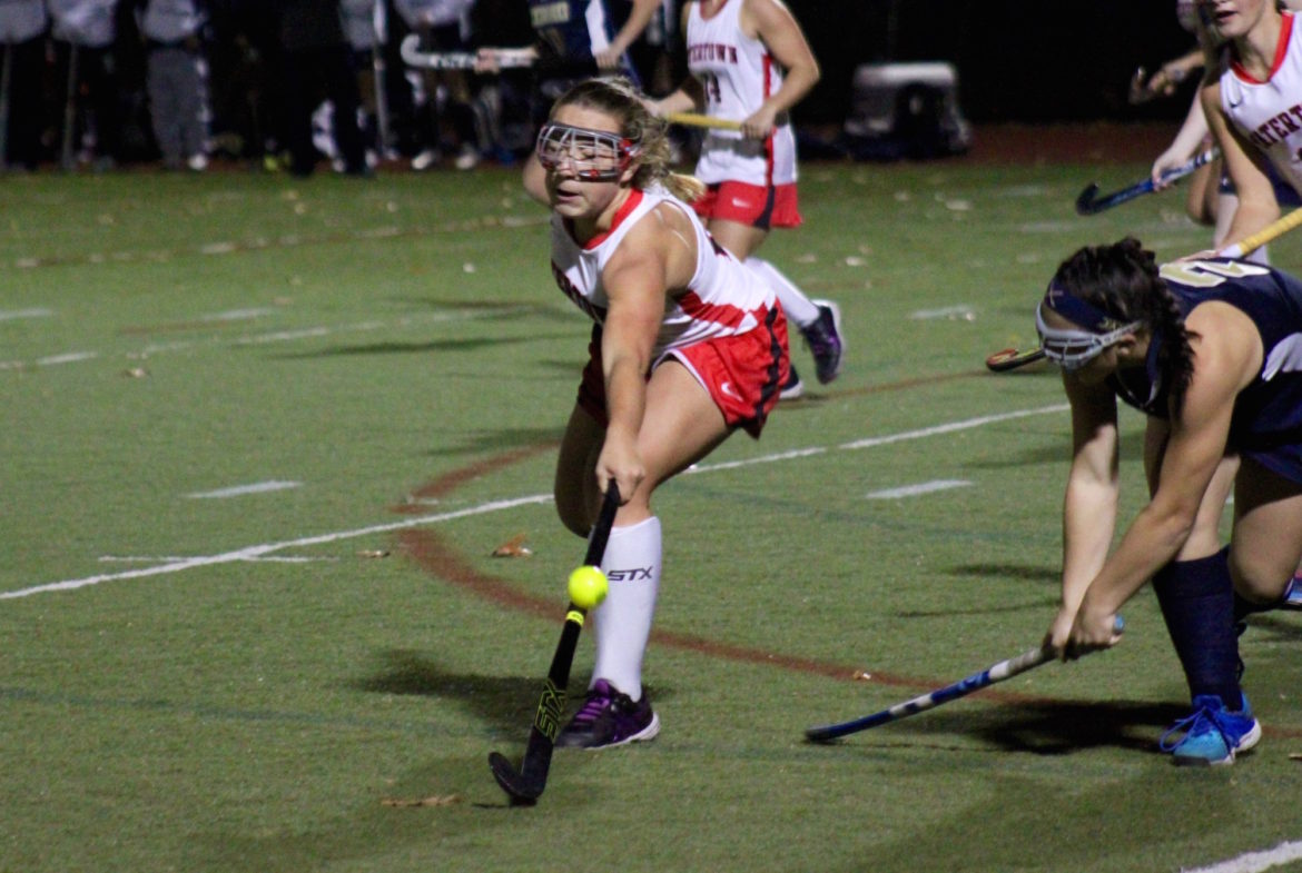 Watertown's Sydney Poulin reaches for a ball in the state semifinal against Foxborough. The junior scored twice.