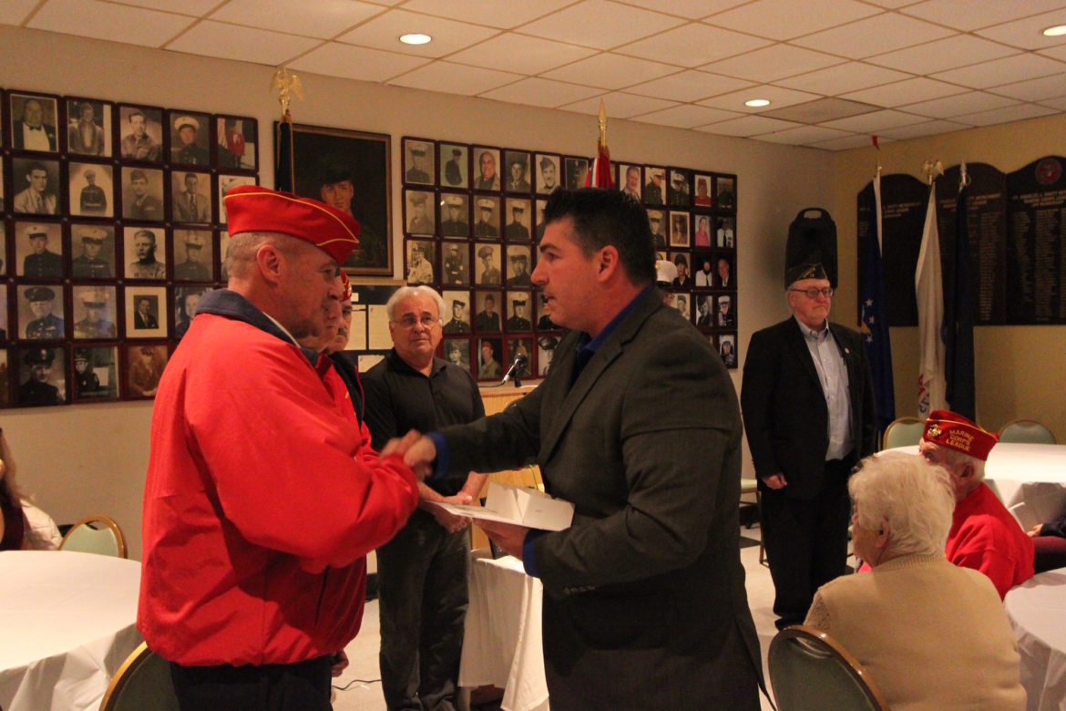 Watertown Veterans Agent Mark Comeiro surprised several veterans with Vietnam Veteran pins at the Veterans Day Ceremony.