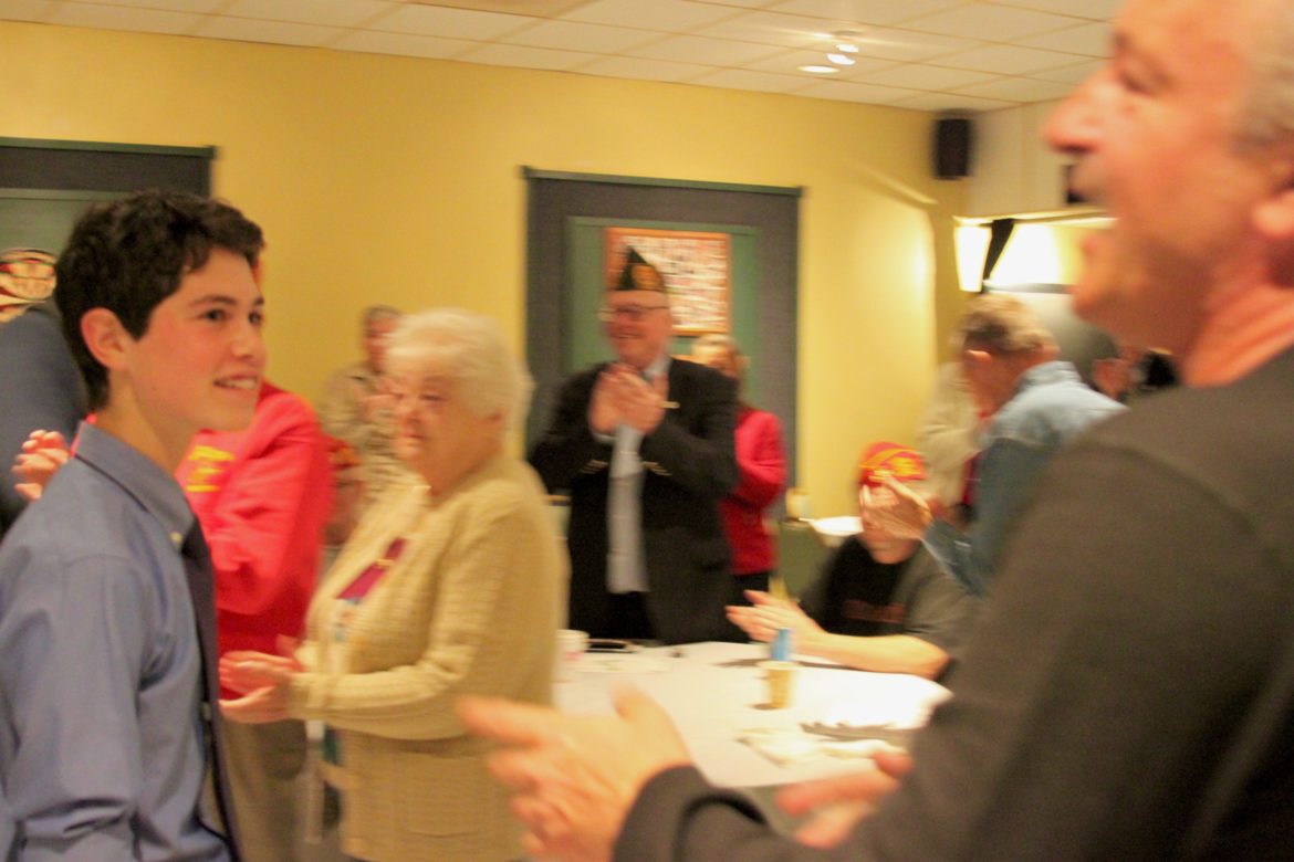 Watertown High School junior Jeremy Ornstein received a standing ovation after reading his essay on the importance of Veterans Day.