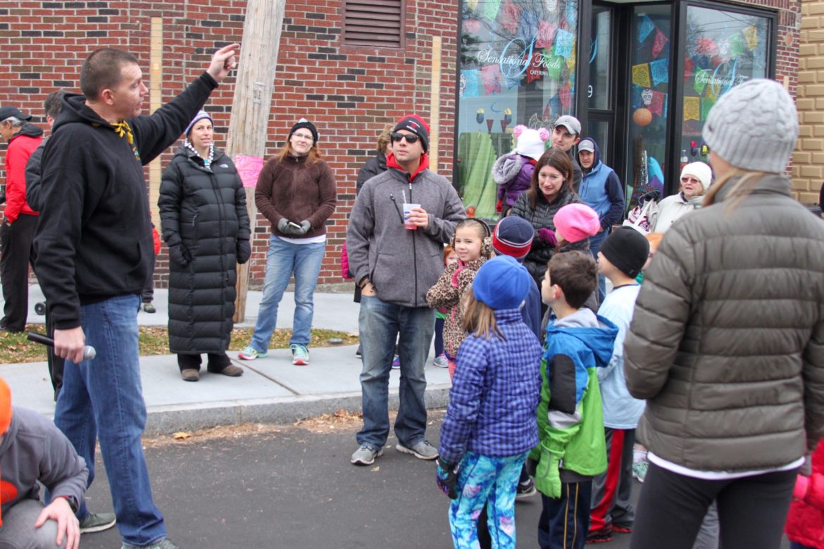 Donohue's owner John Donohue prepares kids to run in their own Turkey Trot, which was around the block, not 5K.