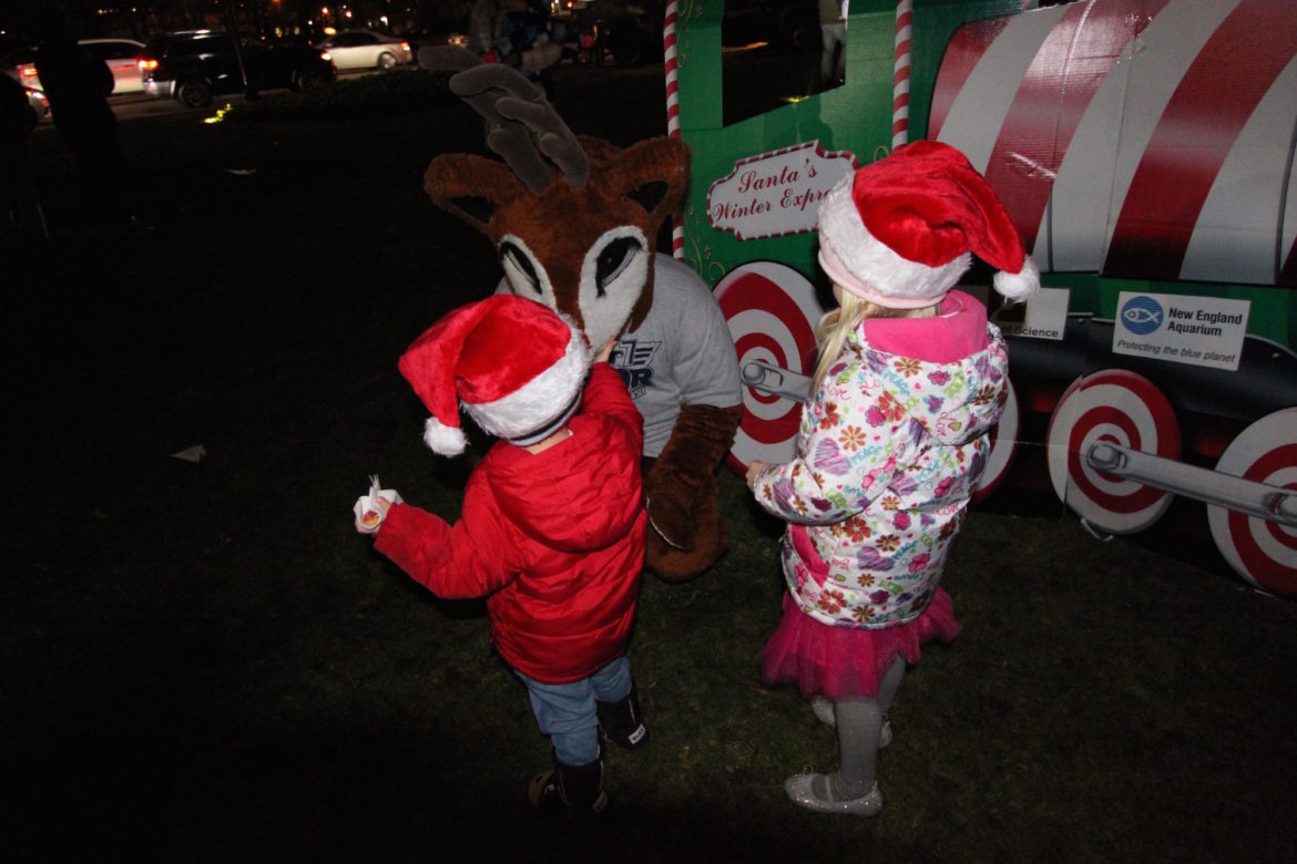 A reindeer mascot from WROR radio greeted children during the Tree Lighting Celebration.